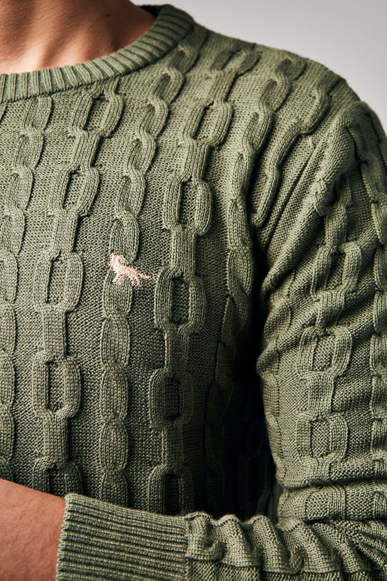 Suéter tejido de punto verde oliva con textura de ochos y logotipo bordado para hombre